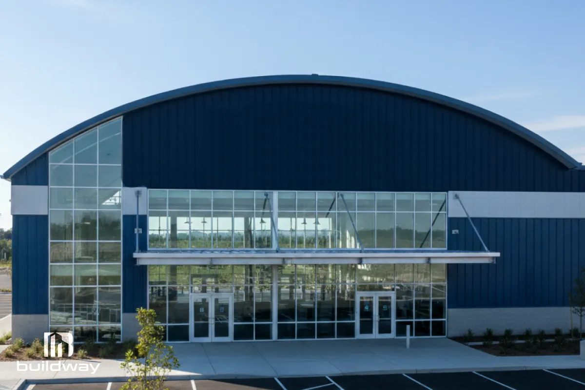 Close-up of the sports facility’s main glass entrance showcasing its modern architectural design.