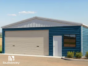 Blue I-beam steel building with a large garage door and white framed window, showcasing durable window framing integration.
